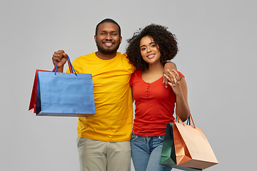 Image showing happy african american couple with shopping bags
