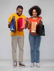 Image showing happy african american couple with shopping bags