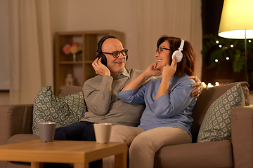 Image showing senior couple with headphones listening to music