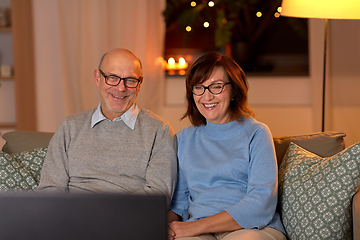 Image showing happy senior couple watching tv at home