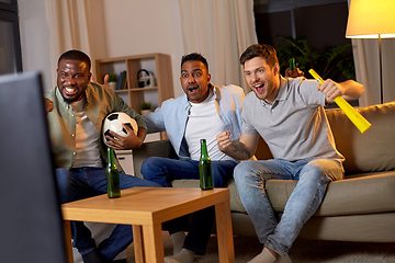 Image showing friends with ball and vuvuzela watching soccer