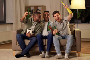 Image showing friends or soccer fans with ball and beer at home