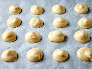 Image showing raw cream puffs on baking pan