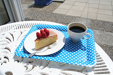 Image showing Piece of cake together with a cup of coffee