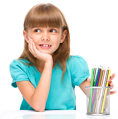 Image showing Little girl with color pencils