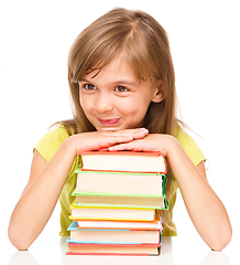 Image showing Little girl with her books