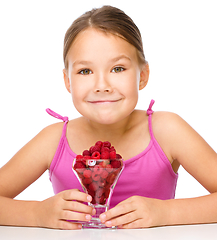 Image showing Little girl with raspberries