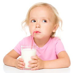 Image showing Cute little girl with a glass of milk