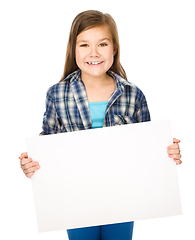 Image showing Little girl is holding a blank banner