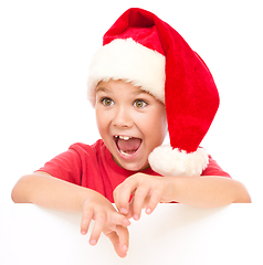 Image showing Little girl is holding blank board