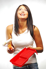 Image showing Woman with paint roller