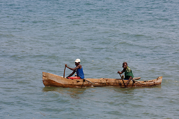 Image showing Malagasy man on sea in traditional handmade dugout wooden boat