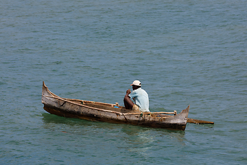 Image showing Malagasy man on sea in traditional handmade dugout wooden boat