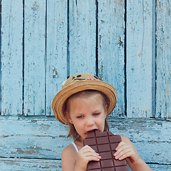 Image showing Girls eat chocolate