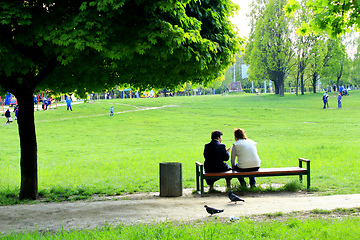 Image showing women have a rest on the bench in city park