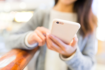 Image showing Woman working on mobile phone