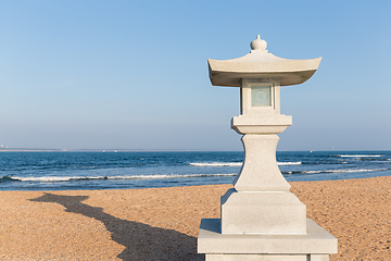 Image showing Stone lantern and seaside