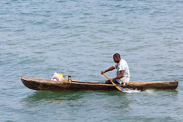 Image showing Malagasy man on sea in traditional handmade dugout wooden boat