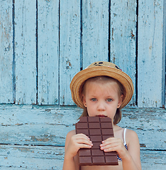 Image showing Girls eat chocolate