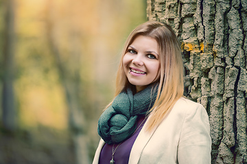 Image showing young woman standing in the fall forest