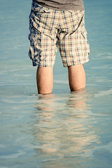 Image showing man standing in the sea water