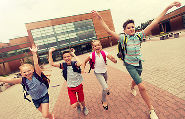 Image showing group of happy elementary school students running