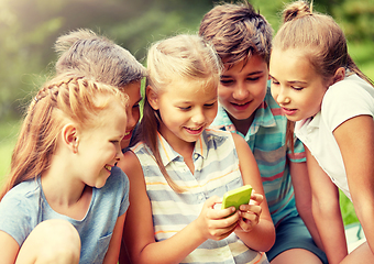 Image showing kids or friends with smartphone in summer park