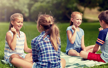 Image showing happy kids playing rock-paper-scissors game