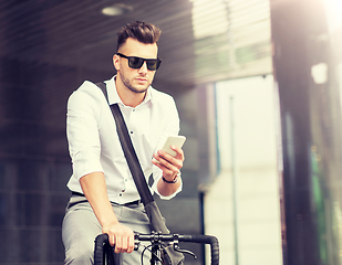 Image showing man with bicycle and smartphone on city street