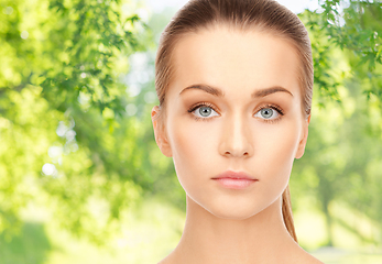 Image showing face of beautiful woman over background