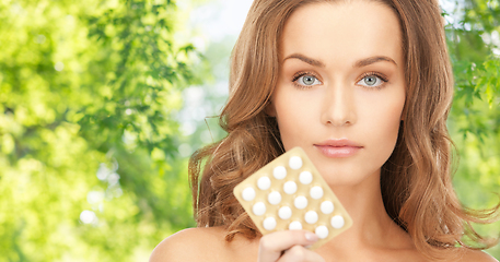 Image showing beautiful woman with medicine pills