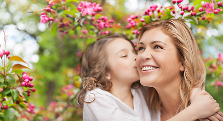 Image showing daughter kissing and hugging happy mother