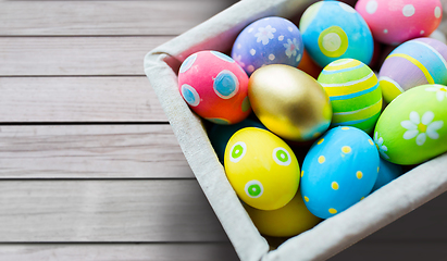 Image showing close up of colored easter eggs in basket