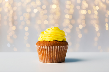 Image showing close up of cupcake or muffin with yellow frosting