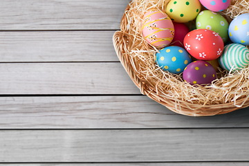 Image showing close up of colored easter eggs in basket