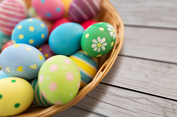 Image showing close up of colored easter eggs in basket