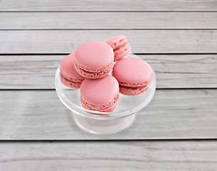 Image showing pink macaroons on glass confectionery stand