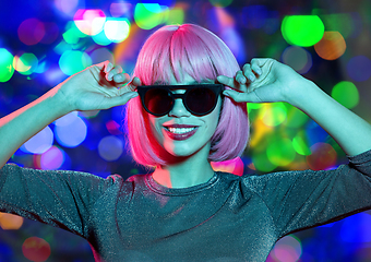 Image showing happy woman in pink wig and black sunglasses