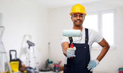 Image showing happy indian painter or builder with paint roller