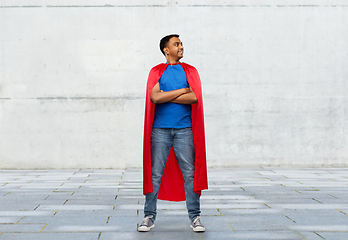 Image showing happy smiling indian man in red superhero cape