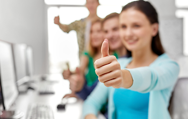 Image showing group of happy students showing thumbs up