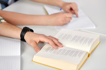 Image showing hands of students with books and notebooks