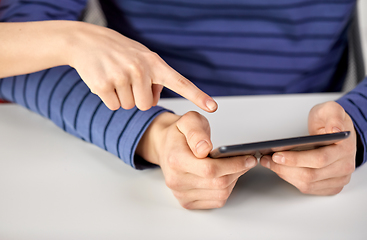 Image showing close up of hands with tablet computer