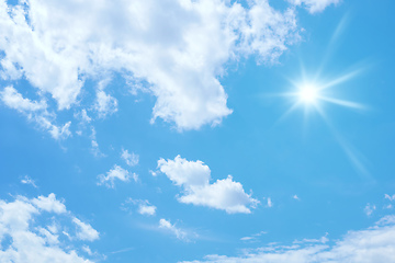 Image showing blue sky with sun and clouds background