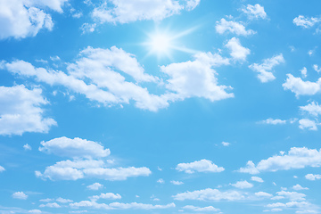 Image showing blue sky with sun and clouds background