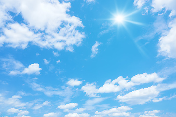 Image showing blue sky with sun and clouds background