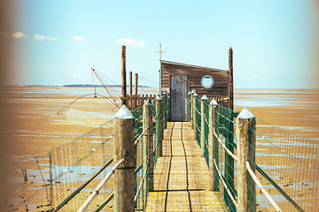 Image showing Hut of fisherman and jetty in the bay