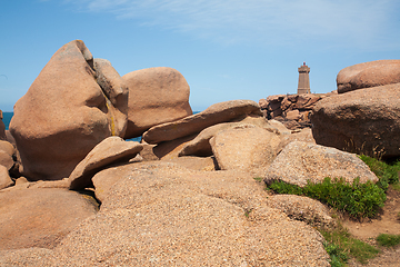 Image showing Pink granite boulders and lighthouse in ploumanach