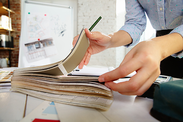 Image showing Interior designer working with colour palette in modern office