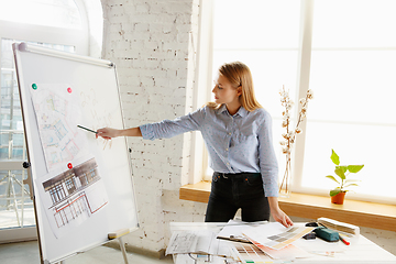 Image showing Interior designer working with colour palette in modern office